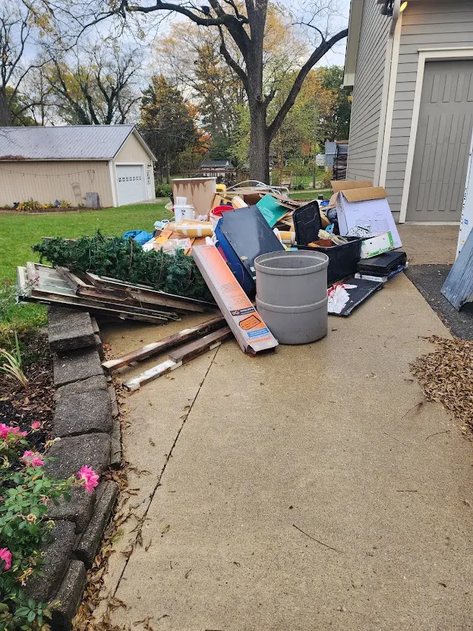 Dumpster being loaded with debris for Commercial Dumpster Rental in Barrett